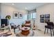 Stylish bedroom features a music theme with a brick wall, comfortable chairs, and ample natural light at 2475 W 69Th Pl, Denver, CO 80221