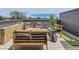 Inviting rooftop deck featuring modern outdoor seating and a putting green for entertainment at 2475 W 69Th Pl, Denver, CO 80221
