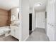 Updated bathroom with granite vanity, vessel sink, and tiled shower at 909 N Logan St # 6K, Denver, CO 80203