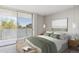 Bright bedroom with balcony access and view of the city skyline at 909 N Logan St # 6K, Denver, CO 80203