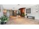 Lobby area with tile floors, plants, and elevator access at 909 N Logan St # 6K, Denver, CO 80203