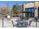 Outdoor patio seating at Carboy Winery with happy hour sign at 909 N Logan St # 6K, Denver, CO 80203