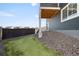 This well-manicured backyard features low-maintenance gravel and artificial grass, offering a serene outdoor space at 21925 E 44Th Pl, Aurora, CO 80019