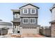 Two-story home featuring stone accents, neutral siding, shuttered windows and a two car garage at 21925 E 44Th Pl, Aurora, CO 80019