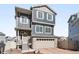 Charming two-story home featuring stone accents, a two-car garage, and a well-maintained front yard with great curb appeal at 21925 E 44Th Pl, Aurora, CO 80019