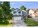 Inviting two-story home featuring lush landscaping, a spacious driveway, and a well-maintained lawn at 9147 W Rockland Pl, Littleton, CO 80128