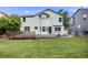 Expansive backyard features a lush lawn and a wooden deck, perfect for entertaining and relaxing at 9147 W Rockland Pl, Littleton, CO 80128