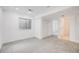 Finished basement with closet, window, and carpet provides a versatile living space at 9147 W Rockland Pl, Littleton, CO 80128