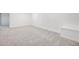 Finished basement area with neutral carpet at 9147 W Rockland Pl, Littleton, CO 80128
