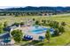 The waterpark-style community pool offers fun for everyone with a splash pad, slides, and shaded lounge areas at 9147 W Rockland Pl, Littleton, CO 80128