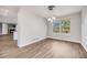 Bright dining room features modern lighting, hardwood floors, and a view of the backyard at 9147 W Rockland Pl, Littleton, CO 80128