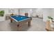 Finished basement game room with a pool table and comfortable seating area at 9147 W Rockland Pl, Littleton, CO 80128