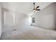 Bright main bedroom featuring vaulted ceiling, ceiling fan and large windows with coverings to provide lots of light at 9147 W Rockland Pl, Littleton, CO 80128
