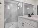 Sleek bathroom offers a frameless glass shower, bench, and contemporary fixtures at 5037 N Quemoy St, Aurora, CO 80019