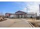 Exterior view of the clubhouse with modern architecture and ample parking at 5037 N Quemoy St, Aurora, CO 80019