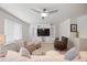 Cozy living area boasts recessed lights, a ceiling fan, and built in entertainment center at 5037 N Quemoy St, Aurora, CO 80019