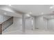 Basement with stairs, fresh paint, and base trim, offering a clean and modern look at 434 Clayton St, Denver, CO 80206