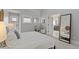 Bright bedroom features decor, a plush chair, and two windows for ample natural light at 434 Clayton St, Denver, CO 80206