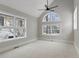 Spacious bedroom with large, arched windows providing views of the surrounding neighborhood at 434 Clayton St, Denver, CO 80206