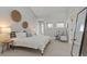Bright bedroom features decor, a plush chair, and two windows for ample natural light at 434 Clayton St, Denver, CO 80206