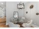 Stylish dining area with a glass table, modern chandelier, and neutral decor at 434 Clayton St, Denver, CO 80206