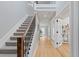 Well-lit hallway with hardwood floors, staircase, and contemporary design elements at 434 Clayton St, Denver, CO 80206