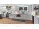 Modern kitchen with white cabinetry, stainless steel appliances, and ample counter space at 434 Clayton St, Denver, CO 80206
