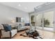Cozy living room with skylights and a view of the landscaped outdoor area at 434 Clayton St, Denver, CO 80206