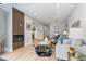 Inviting living space featuring an open layout, hardwood floors, and a fireplace at 434 Clayton St, Denver, CO 80206