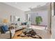 Bright living room with a comfortable sofa, skylight, and access to a private patio at 434 Clayton St, Denver, CO 80206