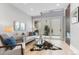 Bright living room with a comfortable sofa, skylight, and access to a private patio at 434 Clayton St, Denver, CO 80206