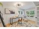Stylish home office with modern lighting, wainscoting, and large windows providing natural light at 434 Clayton St, Denver, CO 80206