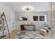 Bright home office with modern light fixture and neutral tones for a calming workspace at 434 Clayton St, Denver, CO 80206