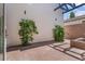 Private patio with brick pavers and lush greenery offers a secluded outdoor space at 434 Clayton St, Denver, CO 80206