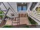Aerial view of a brick patio with an outdoor staircase and landscaped greenery at 434 Clayton St, Denver, CO 80206
