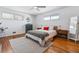 Charming bedroom features hardwood floors, a ceiling fan, and generous natural light from windows at 2738 S Newton St, Denver, CO 80236