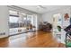 Bright living room featuring hardwood floors, a ceiling fan, and a sliding glass door to the outdoor patio at 2738 S Newton St, Denver, CO 80236