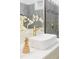 Modern bathroom features a sink, marble countertop, and a glass-enclosed shower at 2930 W 34Th Ave, Denver, CO 80211