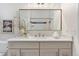 Tastefully decorated bathroom featuring a white vanity with gold fixtures and decor at 2930 W 34Th Ave, Denver, CO 80211
