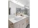 Elegant bathroom featuring double sinks, a large mirror, and modern lighting at 2930 W 34Th Ave, Denver, CO 80211