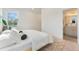 Cozy bedroom with a view into the bathroom and featuring bright natural light at 2930 W 34Th Ave, Denver, CO 80211