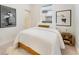 Cozy bedroom with white bedding, decor and natural light, creating a peaceful retreat at 2930 W 34Th Ave, Denver, CO 80211
