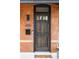 Attractive front door with modern accents on a classic brick home at 2930 W 34Th Ave, Denver, CO 80211