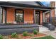 Inviting front porch with stylish seating, decorative trim, and brick accents at 2930 W 34Th Ave, Denver, CO 80211