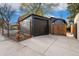 A detached garage with a modern design and concrete driveway at 2930 W 34Th Ave, Denver, CO 80211