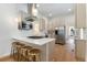 Modern eat-in kitchen features stainless appliances, a bar, and ample lighting at 2930 W 34Th Ave, Denver, CO 80211