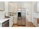 Modern kitchen features stainless appliances and ample cabinets at 2930 W 34Th Ave, Denver, CO 80211