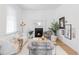 Elegant living room featuring a cozy fireplace and stylish furnishings at 2930 W 34Th Ave, Denver, CO 80211