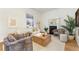 Elegant living room featuring a cozy fireplace and stylish furnishings at 2930 W 34Th Ave, Denver, CO 80211