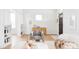 Bright living room boasts hardwood floors, built-in shelves, and designer chair at 2930 W 34Th Ave, Denver, CO 80211